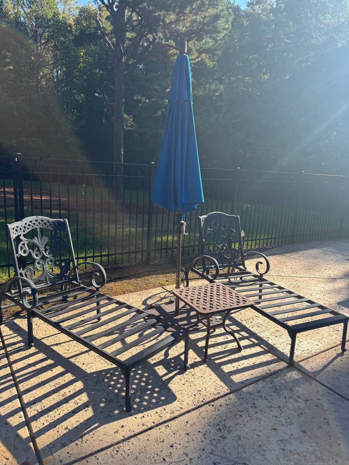 Two Cast Aluminum Chaise Loungers, Scrollwork, with Side Table and Umbrella, Poolside