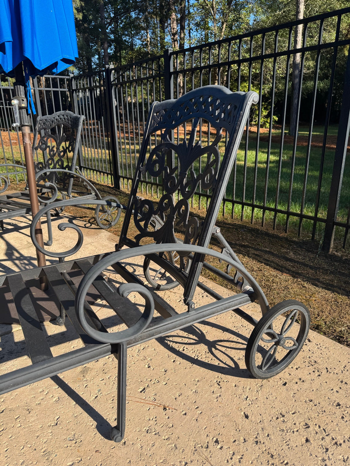 Two Cast Aluminum Chaise Loungers, Scrollwork, with Side Table and Umbrella, Poolside