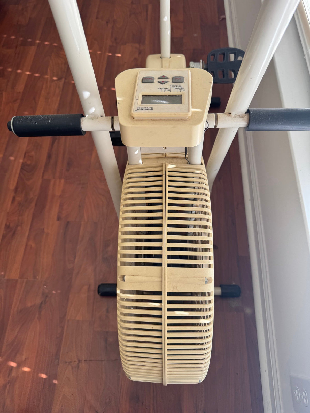 Front view of the bike showing handlebars, display and fan wheel