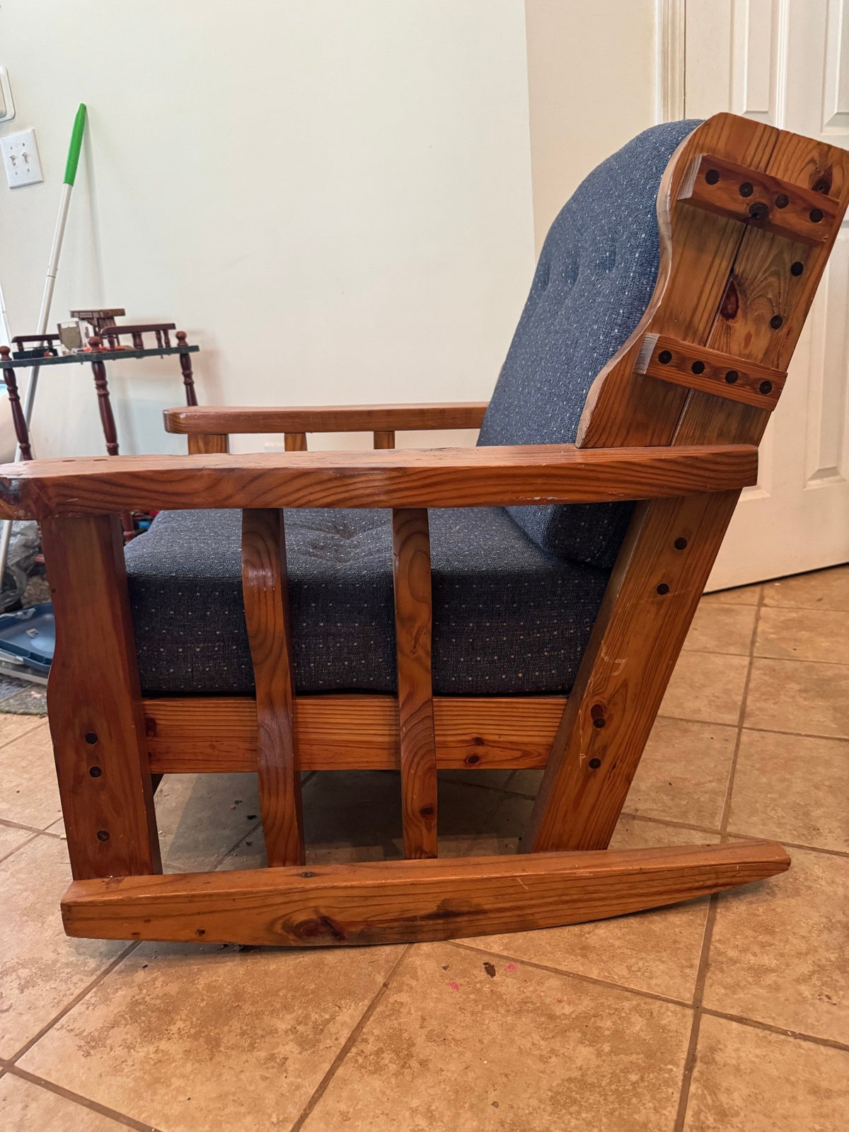 Side view showing the curved rocker runner and slat sides