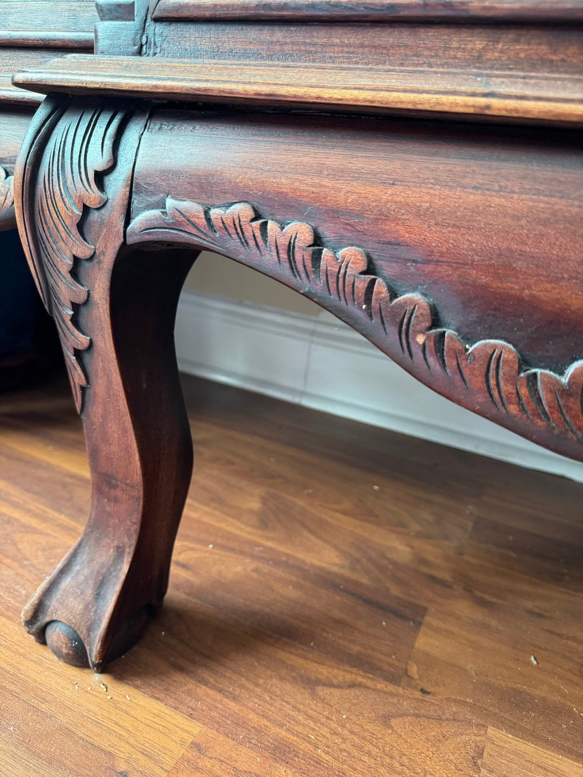 Carved leg and ball-and-claw foot of the cabinet base
