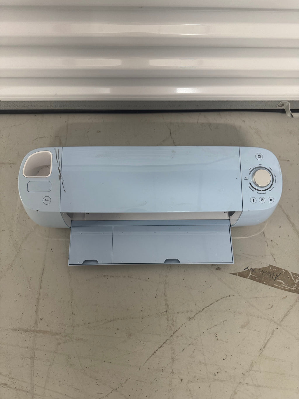 Top drawer open displaying various vinyl rolls and adhesive sheets stored vertically