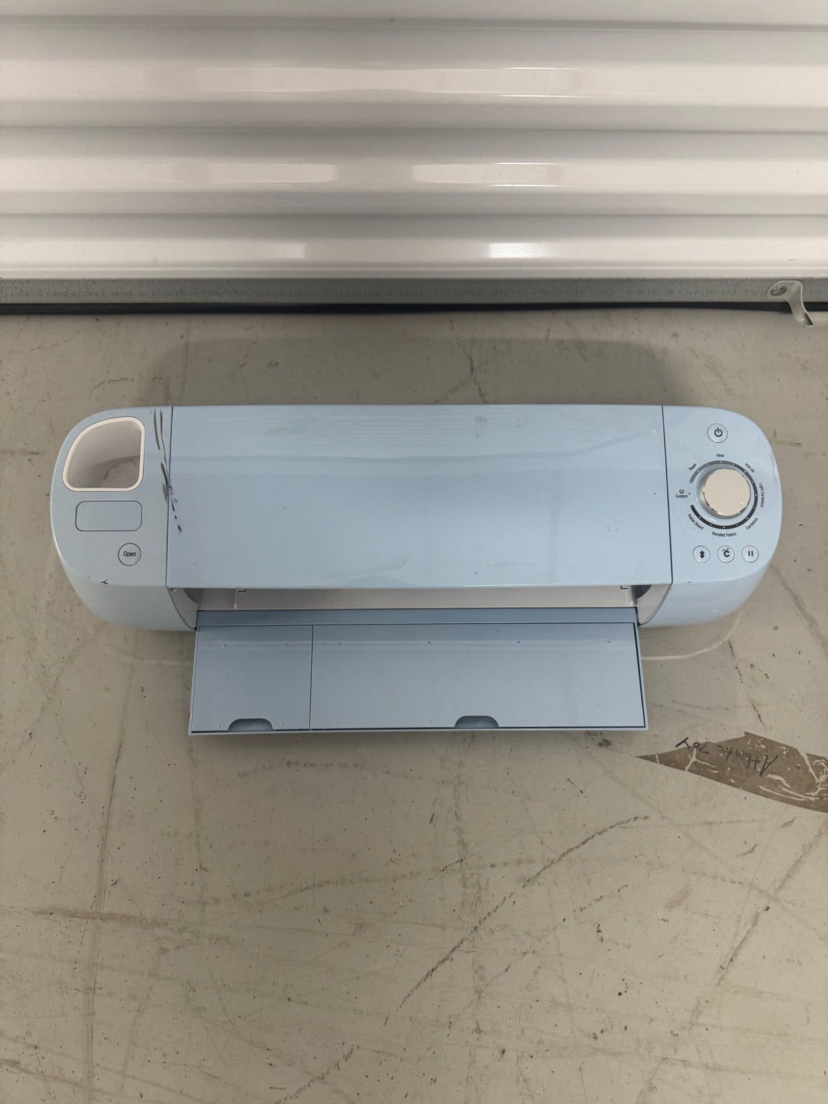 Top drawer open displaying various vinyl rolls and adhesive sheets stored vertically