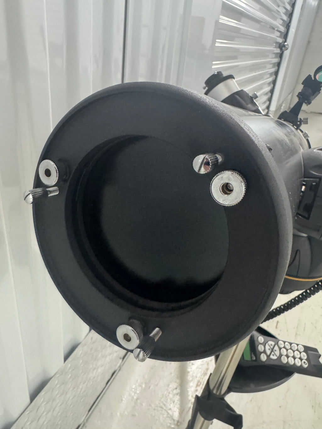 Front view of telescope's primary mirror cell showing circular aperture and mounting hardware