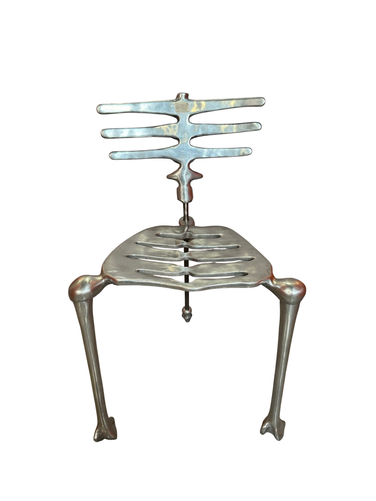 Cast aluminum skeleton chair with rib-cage back, front view