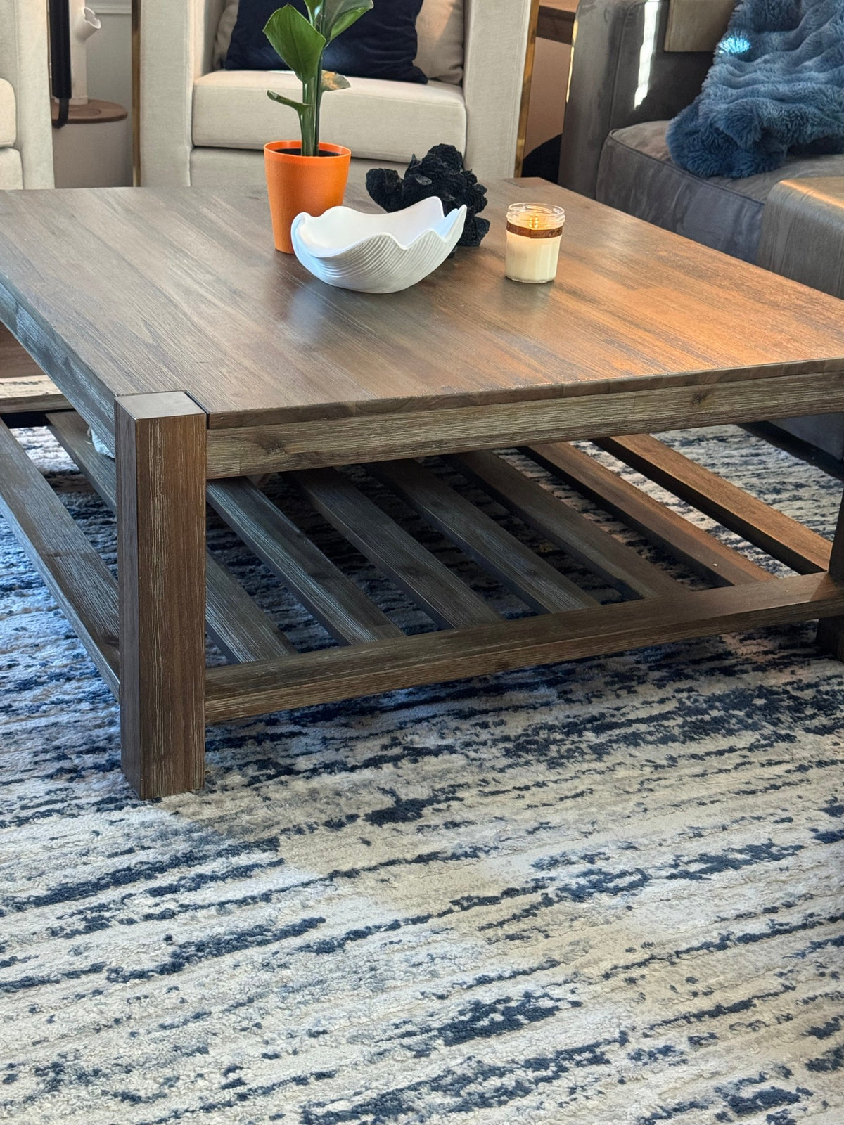 Coffee table with slatted lower shelf