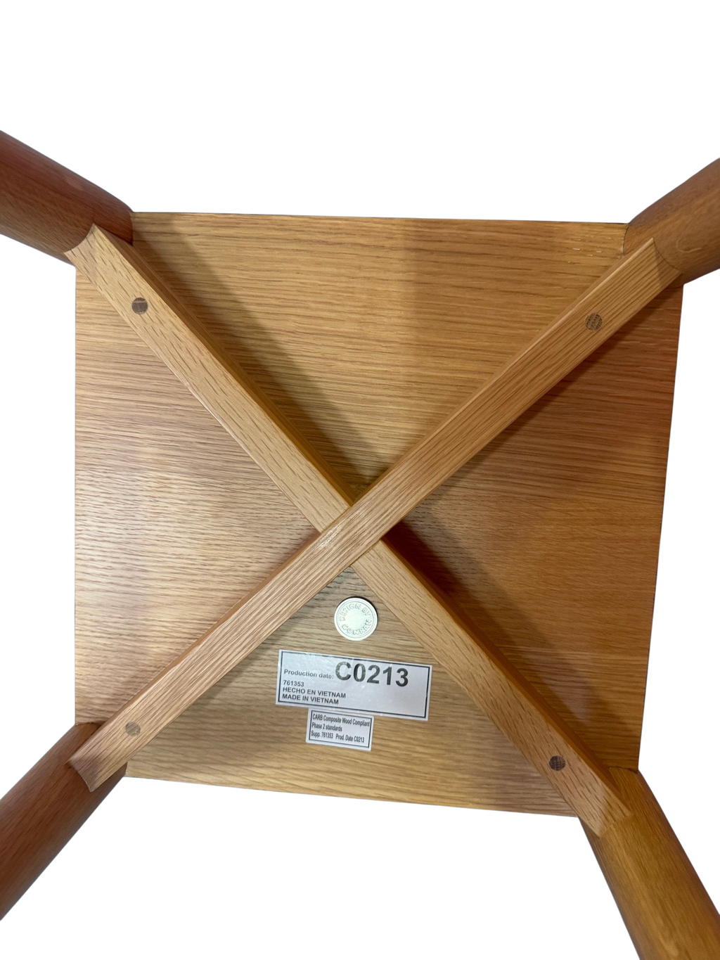 Underside showing the X-brace frame and label