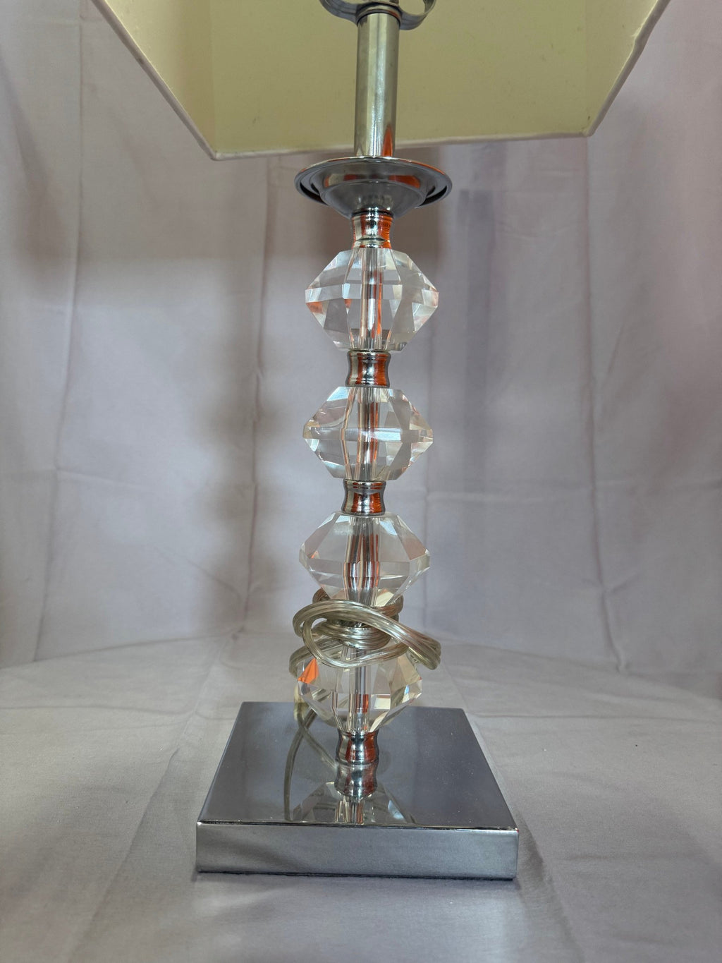 Close view of the faceted stem and chrome base