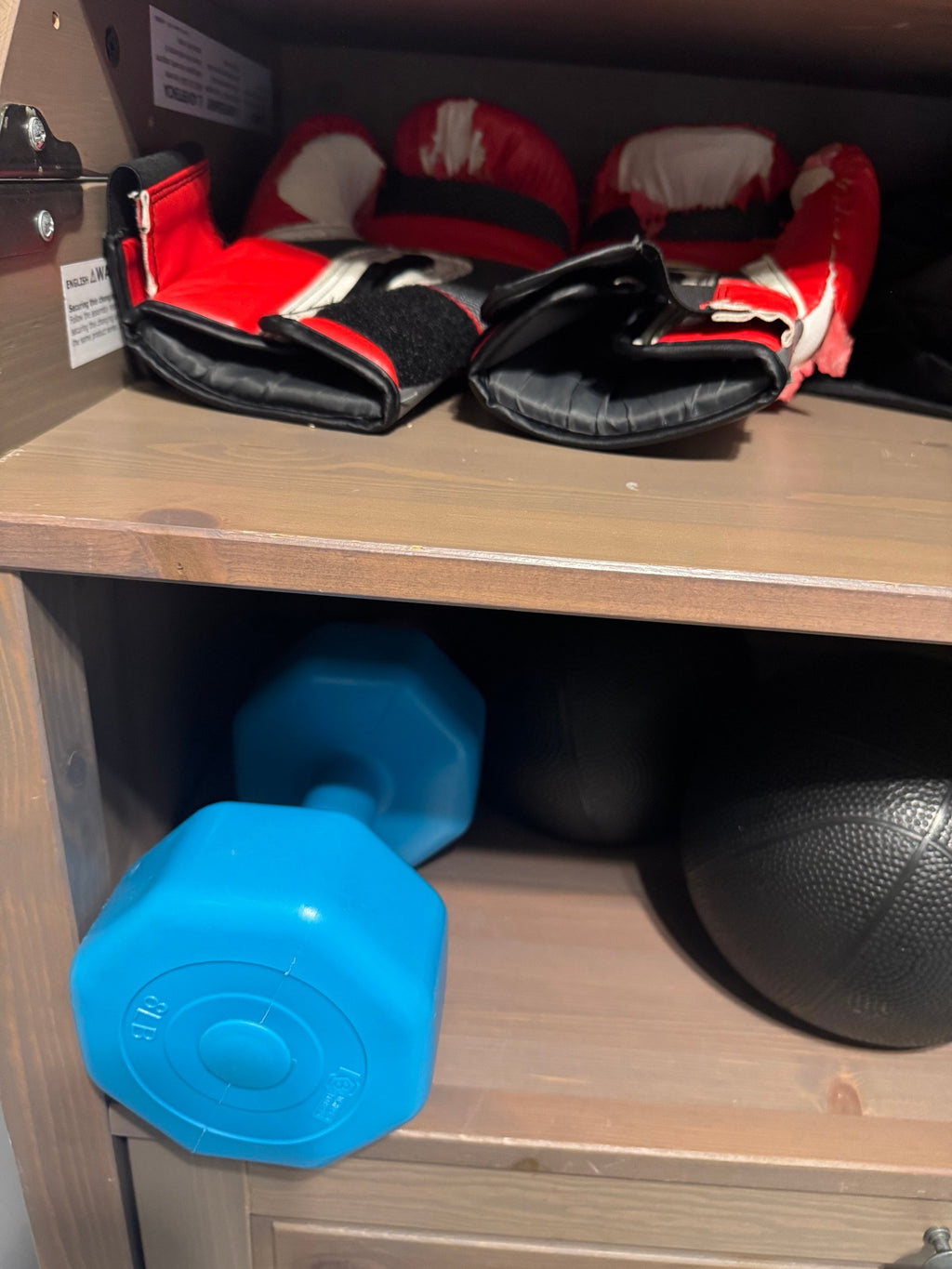 Boxing gloves and blue dumbbell