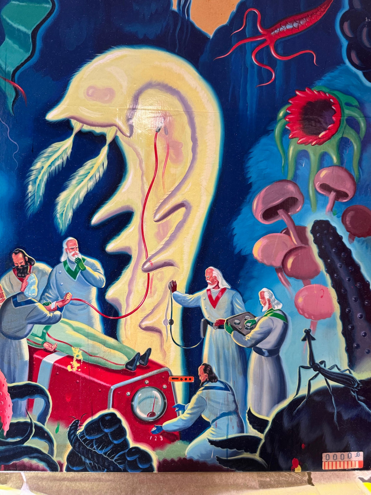 Close view of the figures and red machine