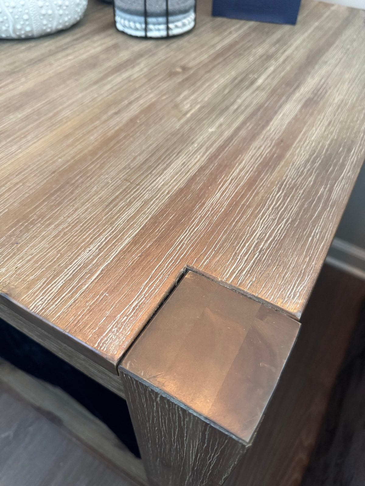 Metal corner cap and wire-brushed top of the end table