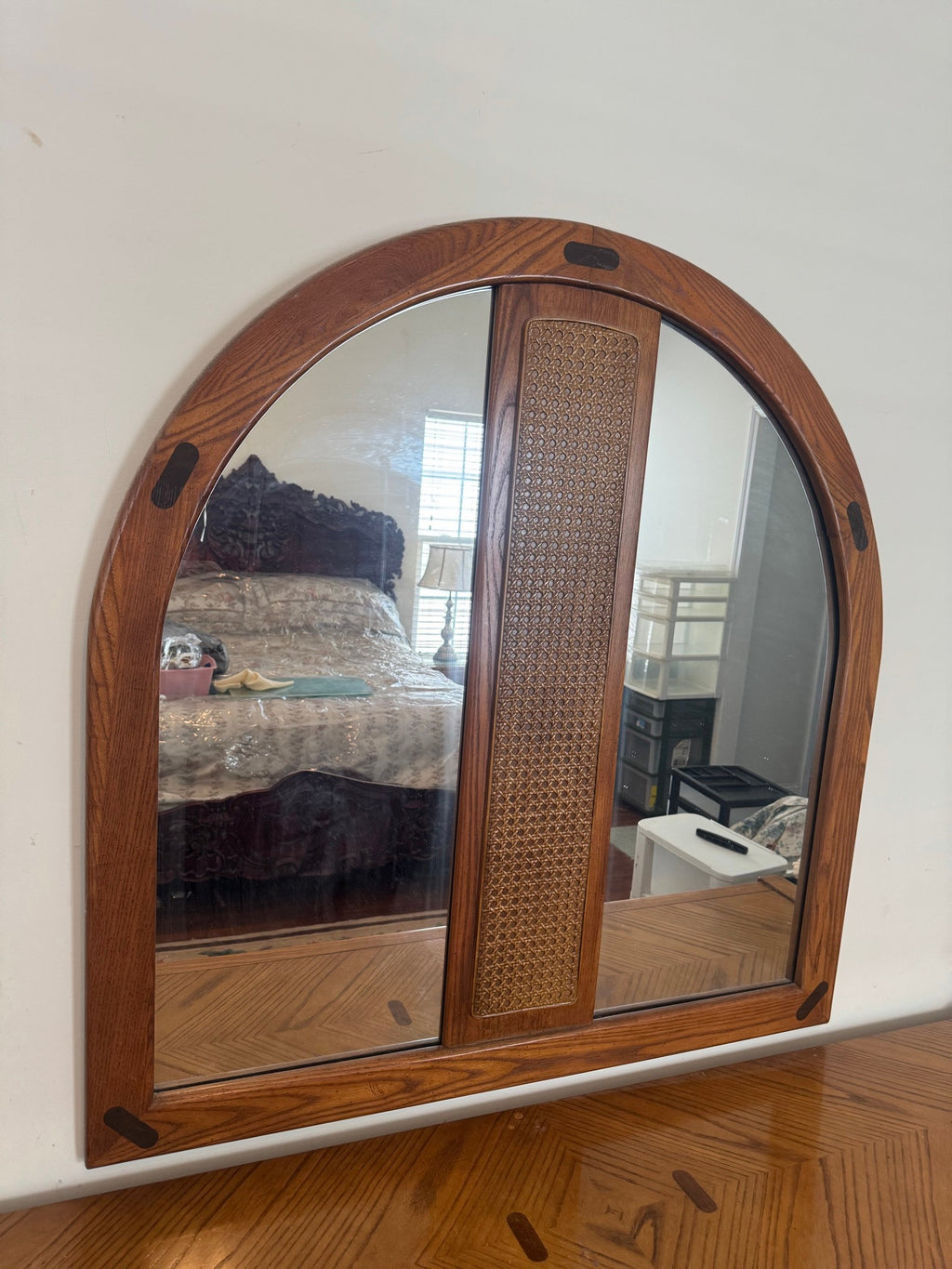 Arched mirror with caned center panel