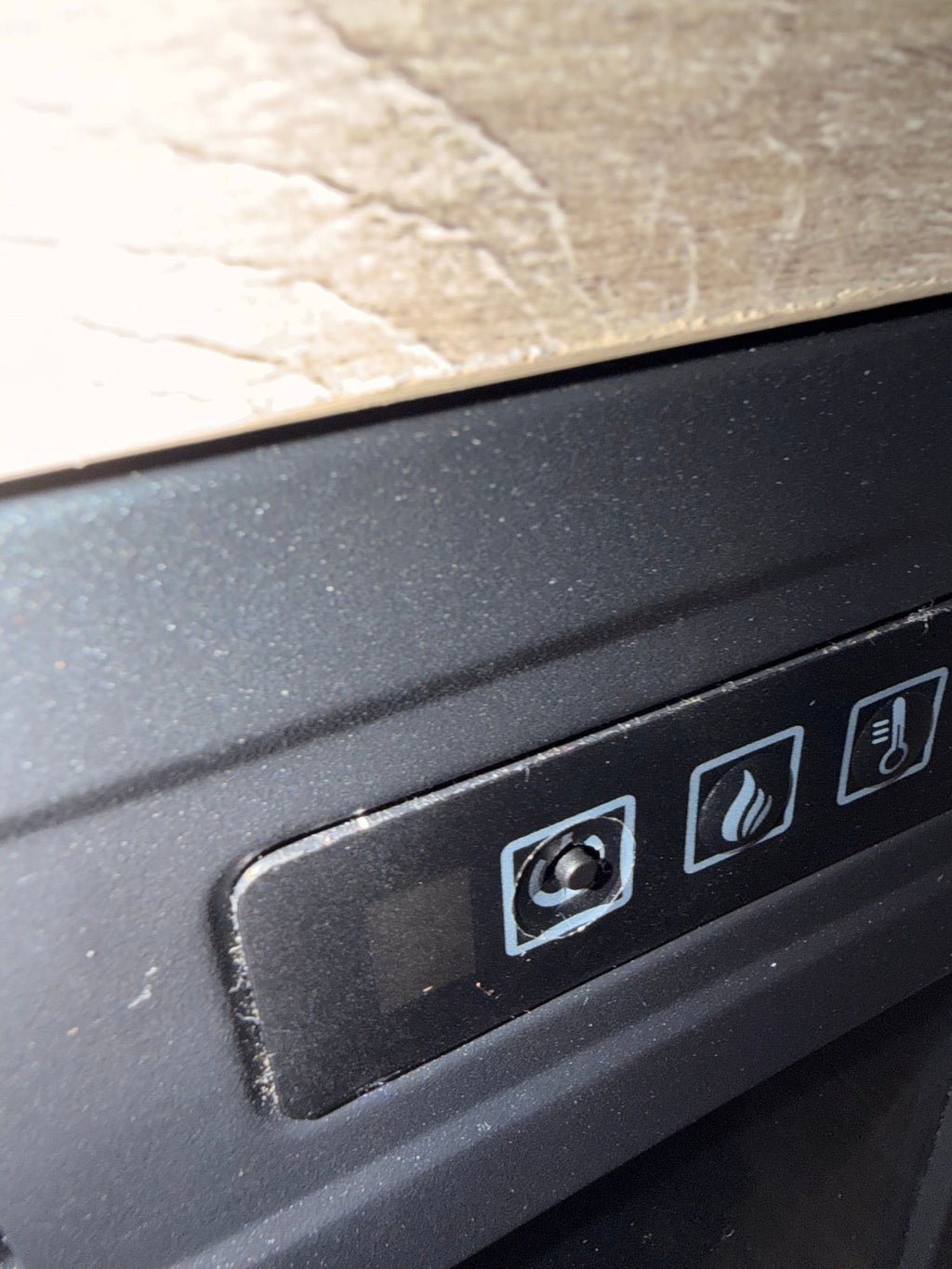 Fireplace control panel with the power button cap missing