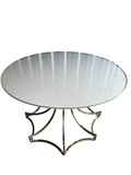 Brass sculptural star base round glass top table, 42 inches, viewed from above at angle showing entire piece