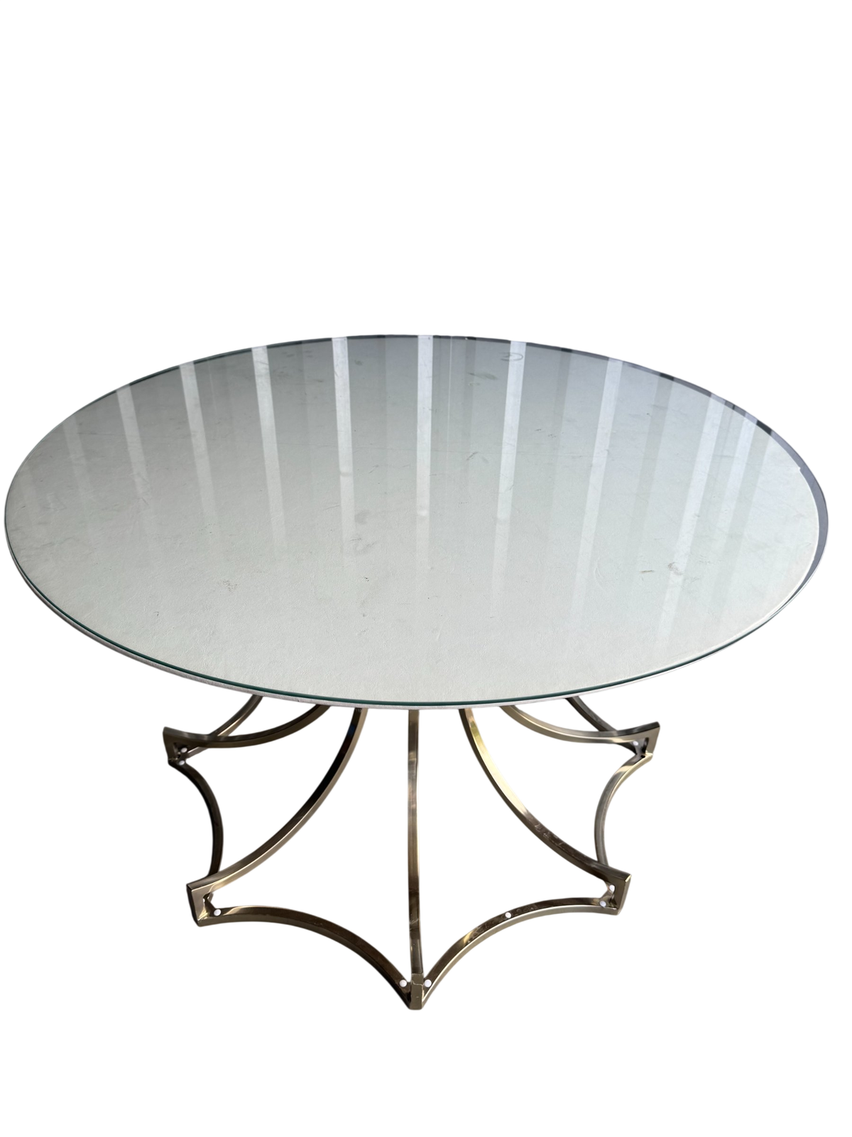 Brass sculptural star base round glass top table, 42 inches, viewed from above at angle showing entire piece