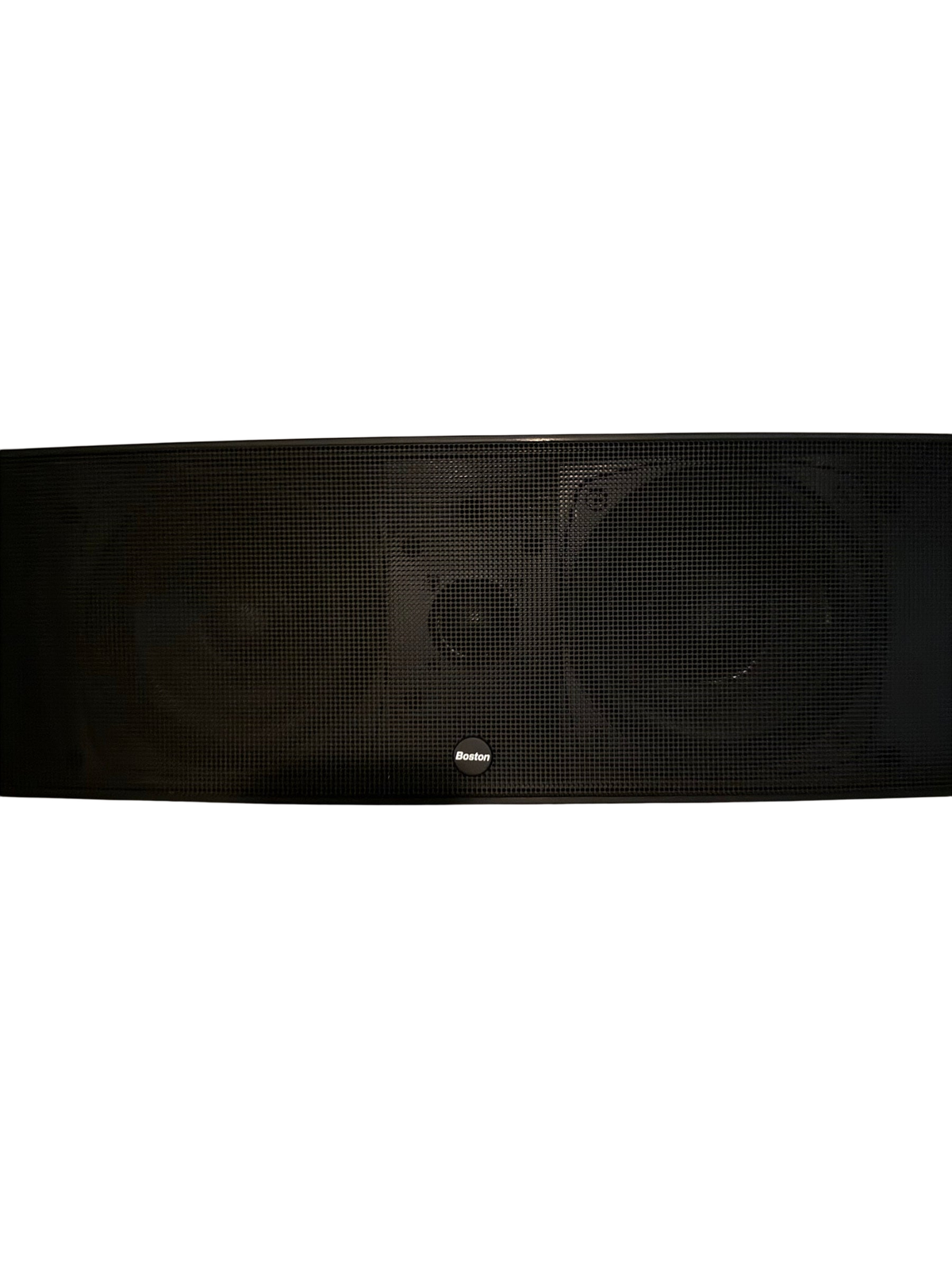 Black Boston Acoustics center channel speaker with mesh grille on a white shelf