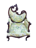 Antique carved walnut ram's head armchair, Rococo Revival, seen from the front with its asymmetrical pierced crest and green silk brocade upholstery