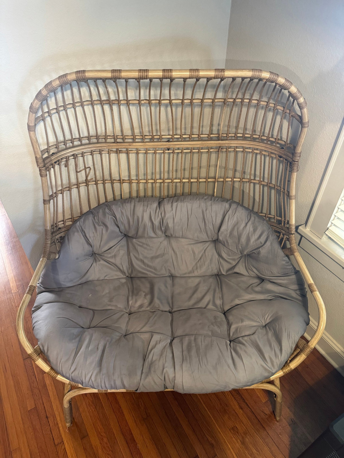 Rattan loveseat from the front with cushion