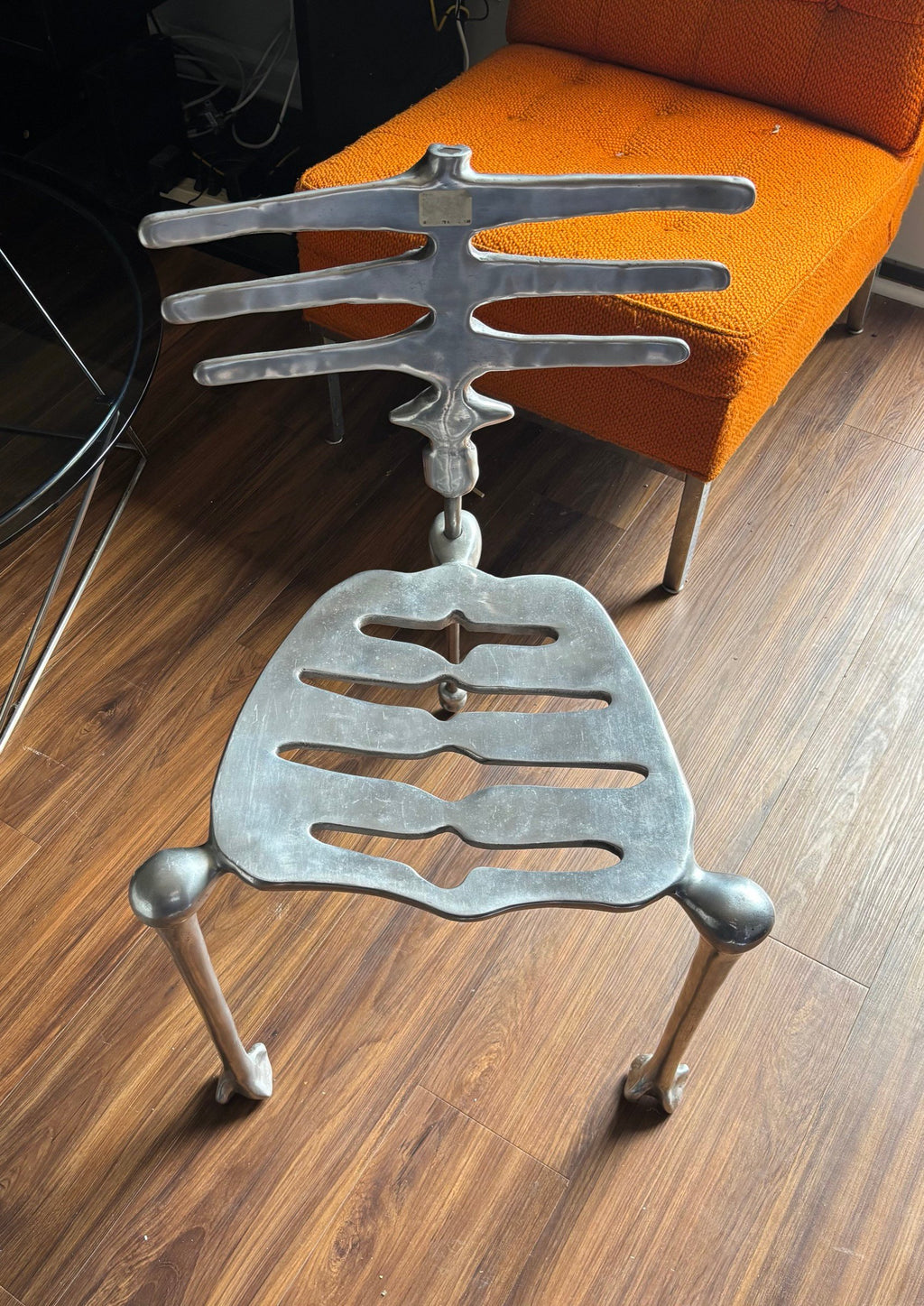 Skeleton chair indoors, front angle