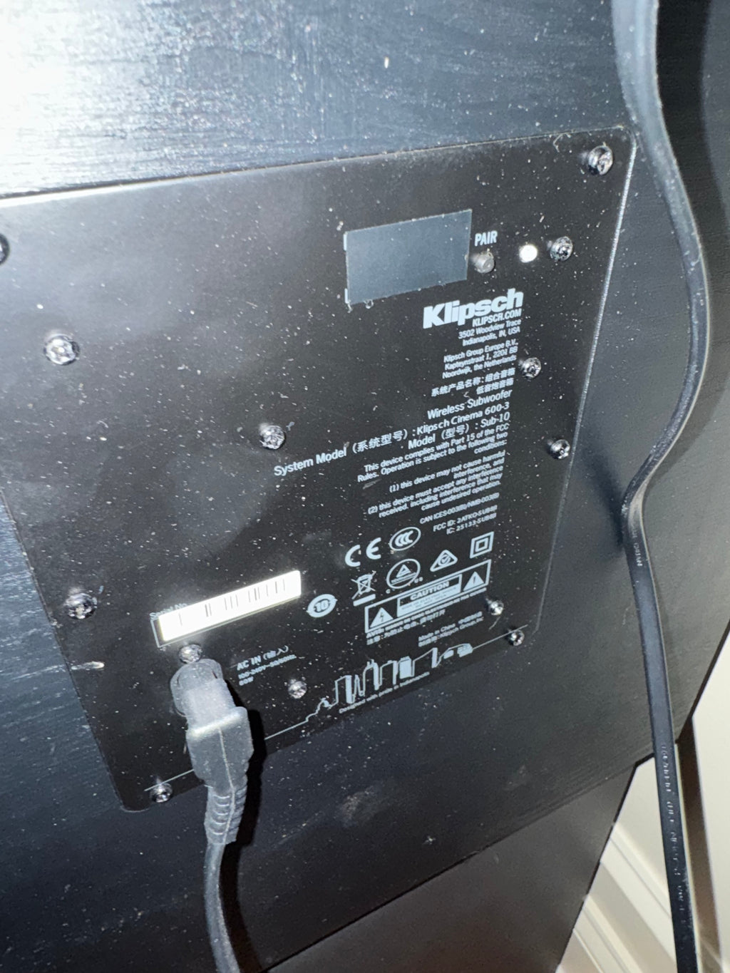 Back panel showing Klipsch branding, wireless pairing button, and power connection port