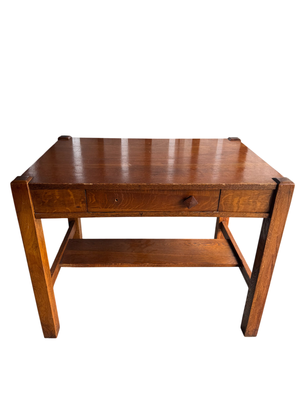Mission Oak side table, front three-quarter view showing rectangular top, single drawer, lower shelf, and four square legs