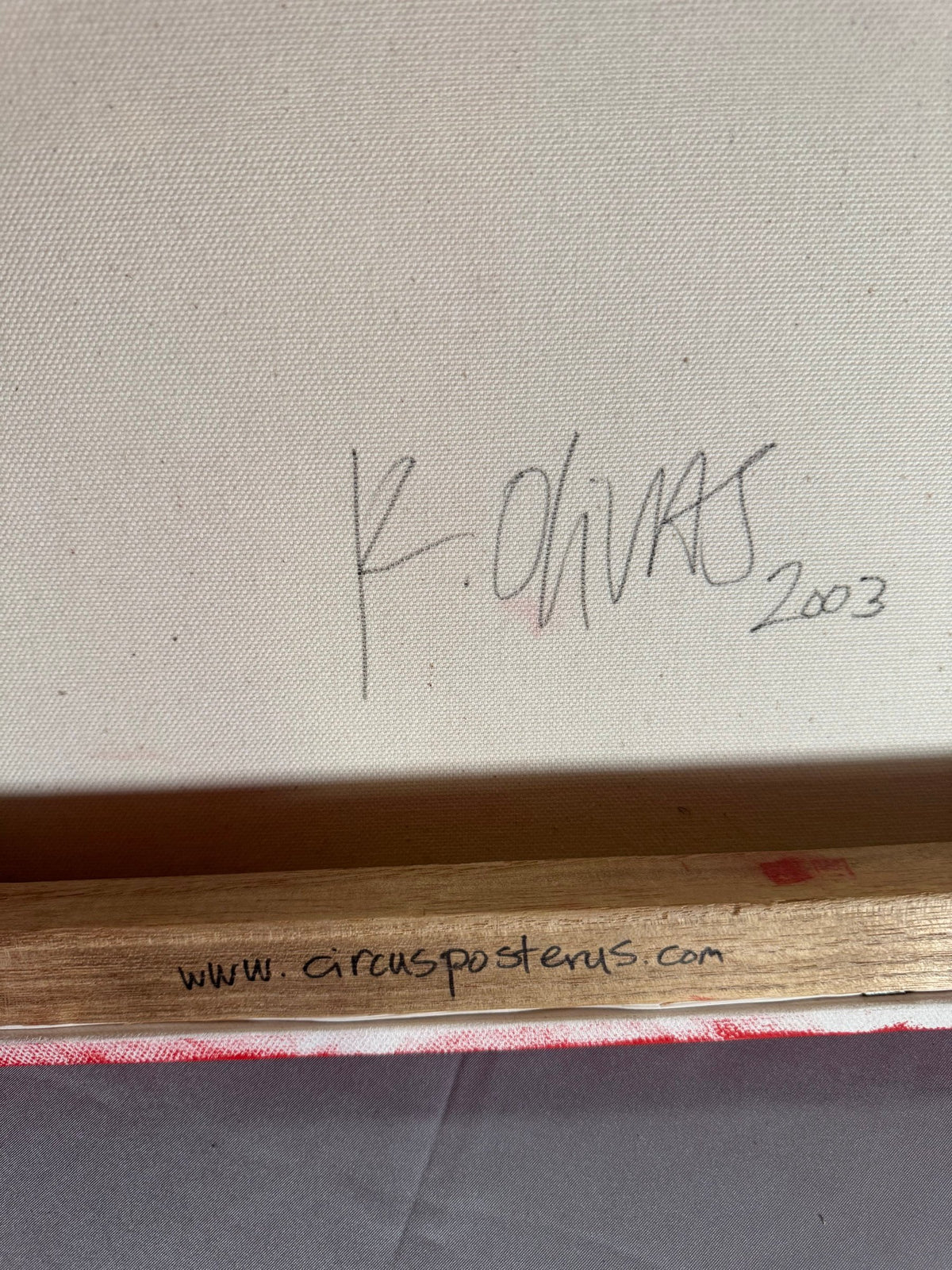 Back of the canvas signed K. Olivas 2003