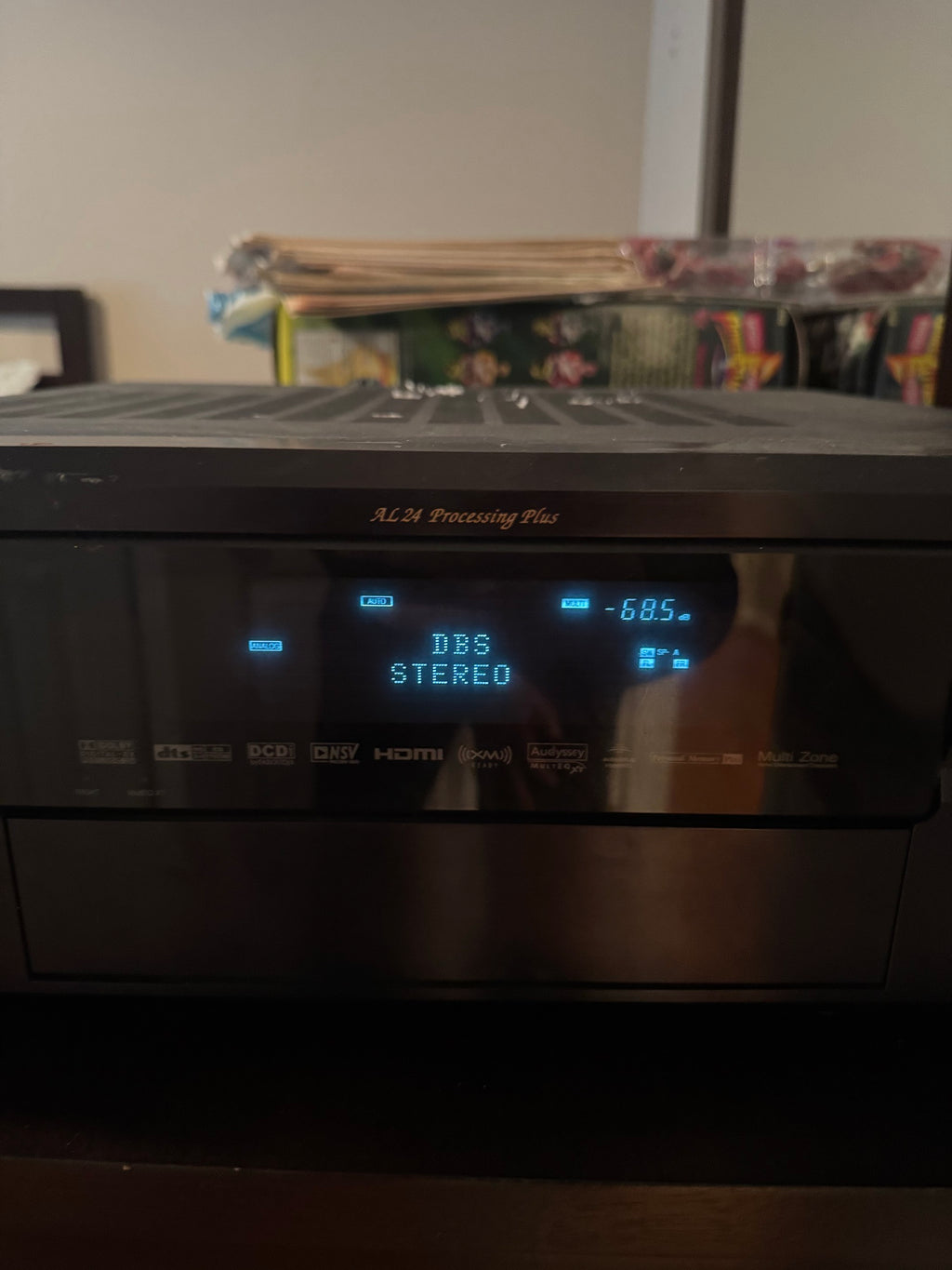 Front view of Denon AVR-2807 display panel showing DBS Stereo and format icons