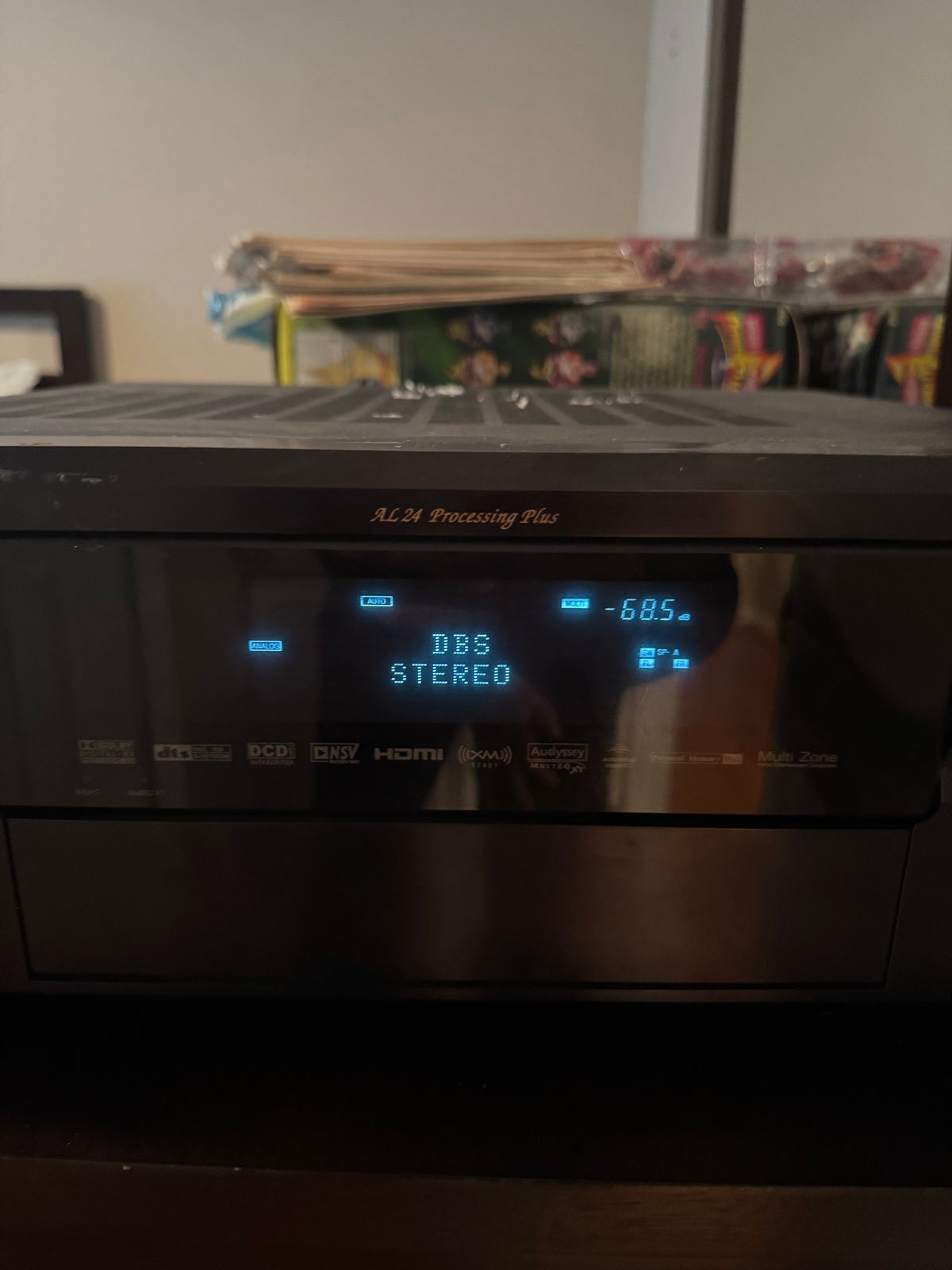 Front view of Denon AVR-2807 display panel showing DBS Stereo and format icons