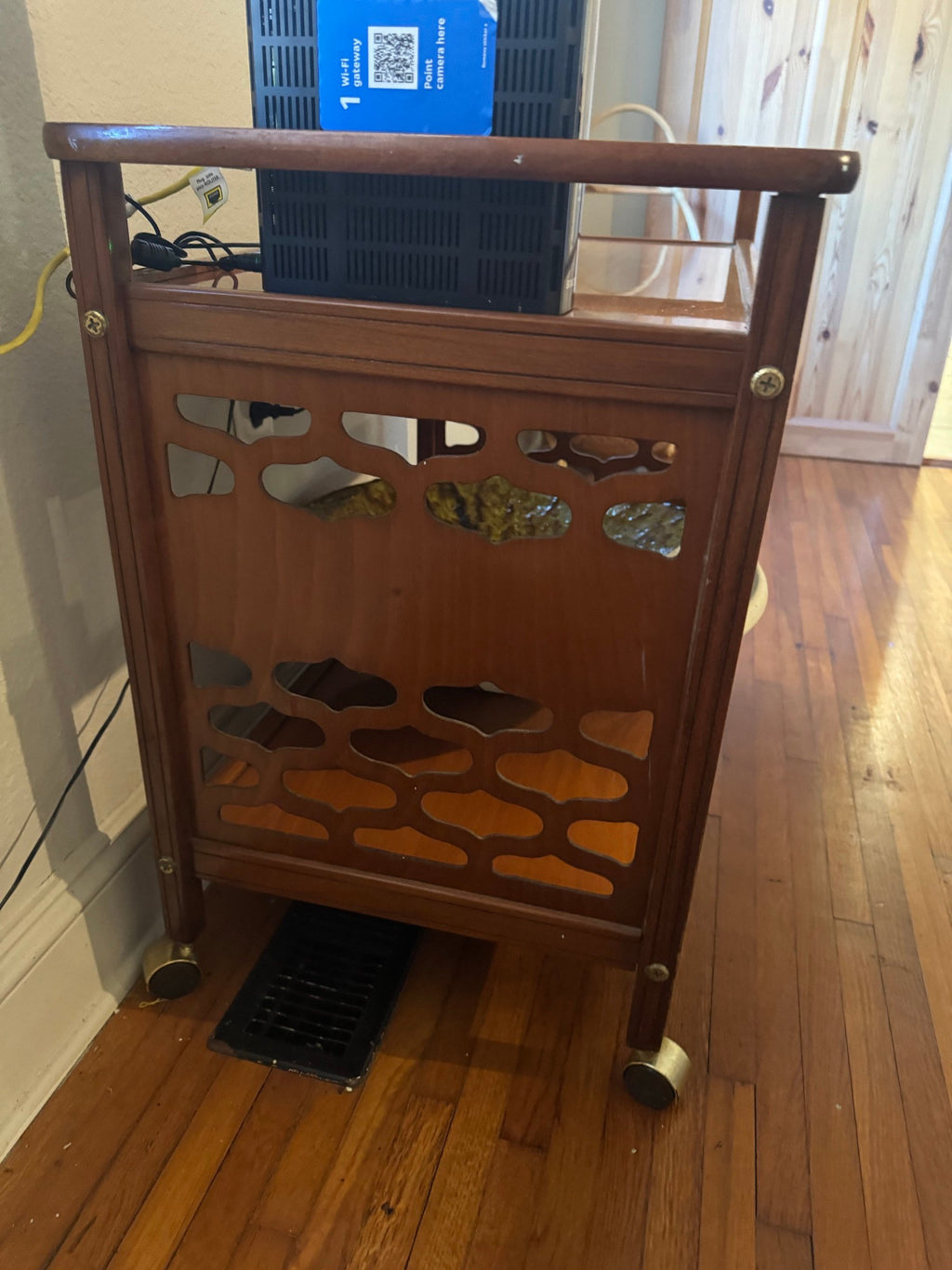 Pierced side panel and caster detail