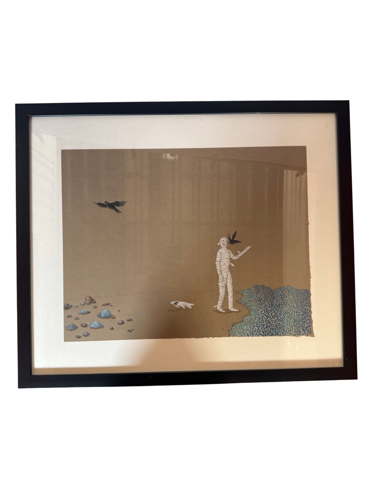 Framed print of a bandaged mummy figure with a black bird, straight-on