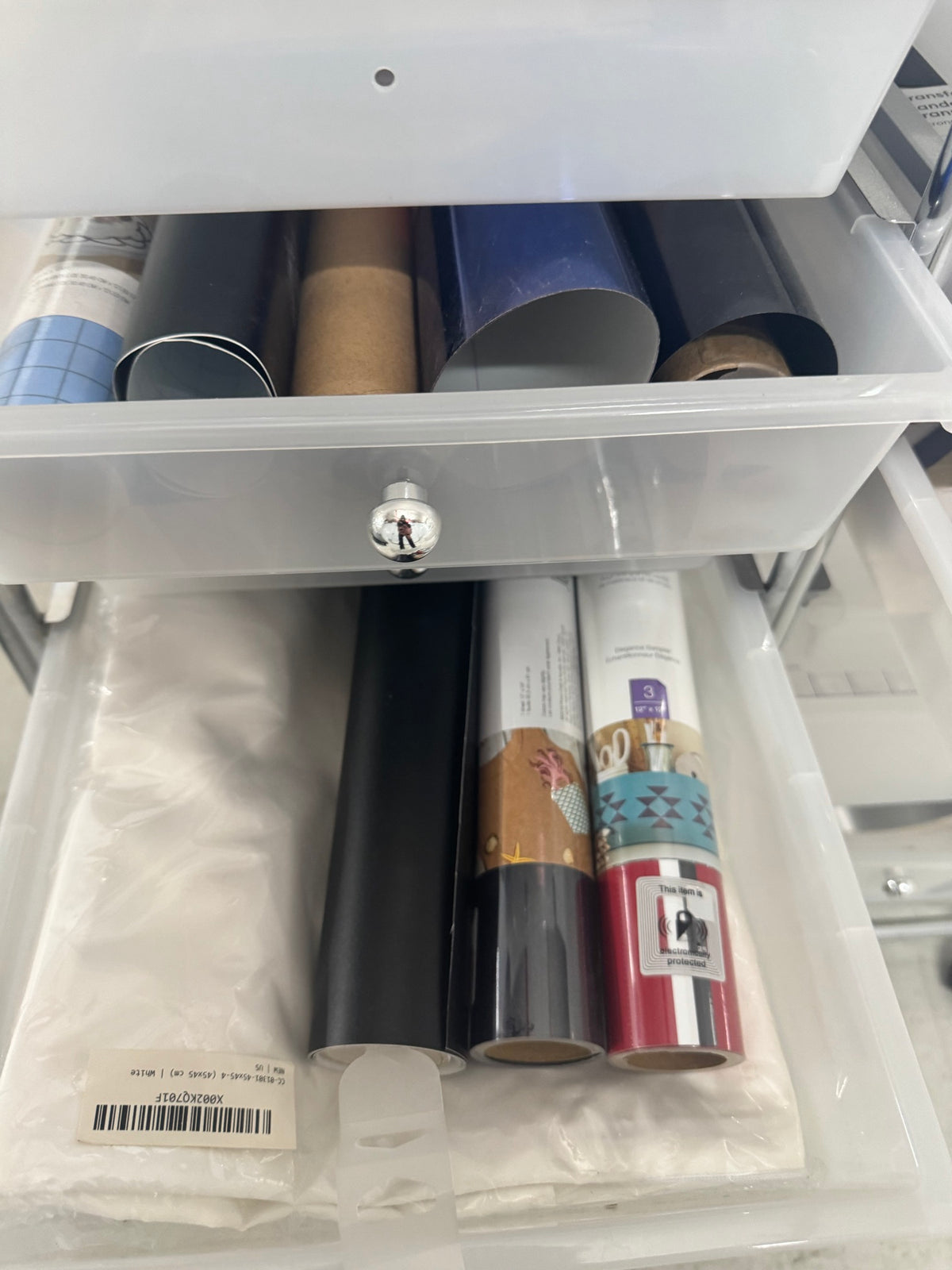Rolling cart full view showing both drawer columns with organized supplies stacked on top