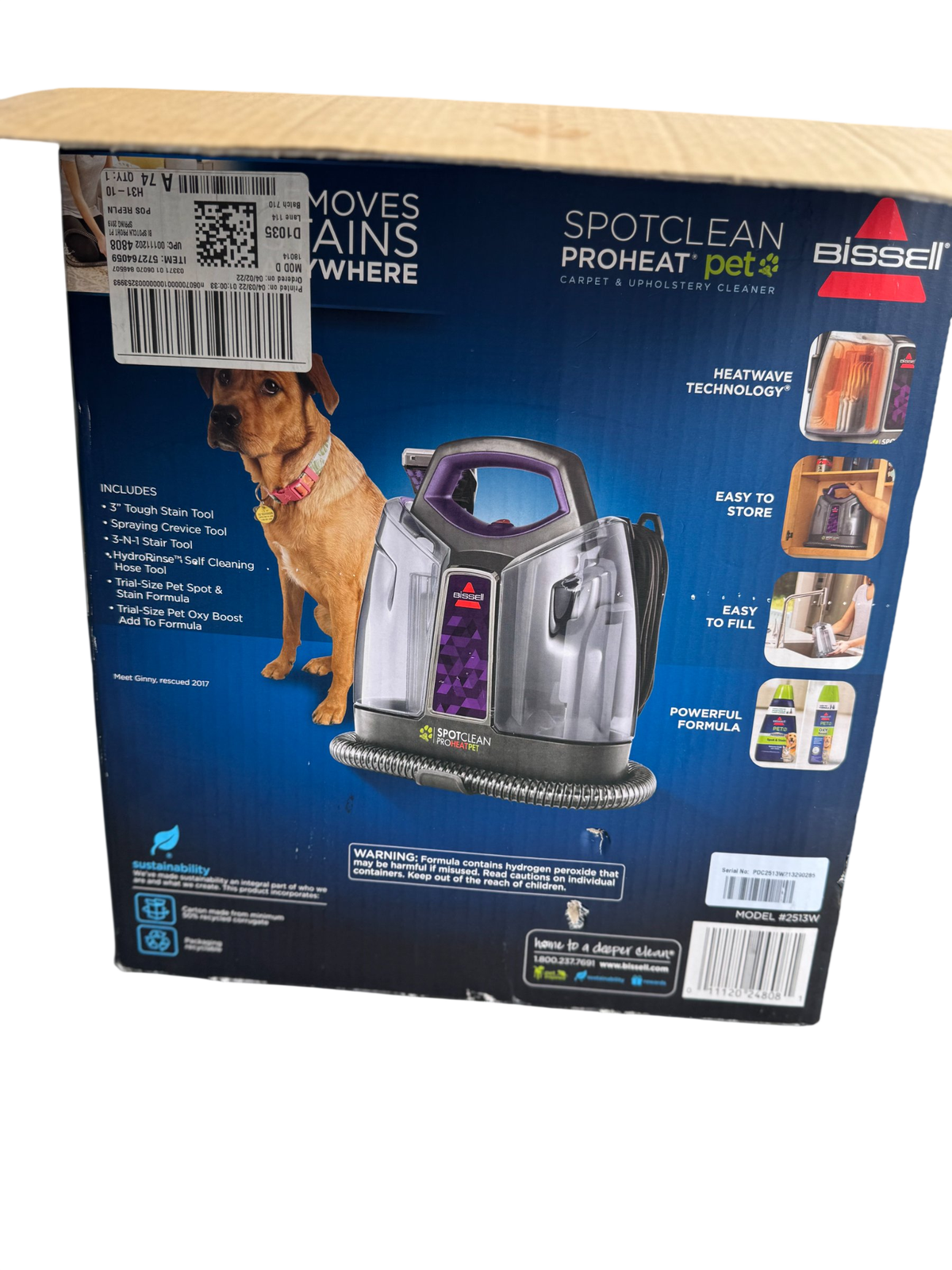 Product packaging box showing Bissell SpotClean ProHeat Pet carpet cleaner with brown dog and purple machine visible