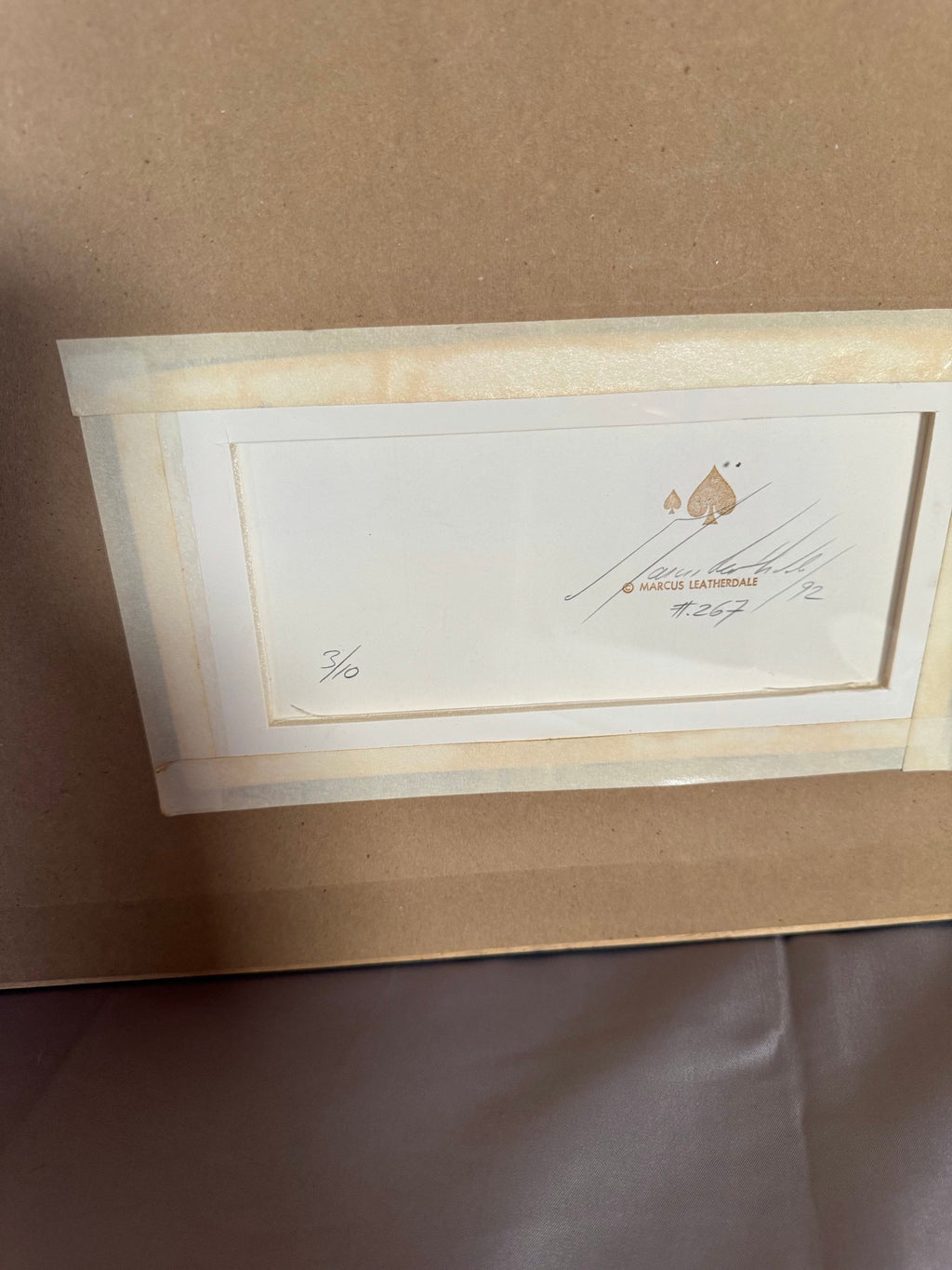 Back with the stamp, signature and 3/10 notation