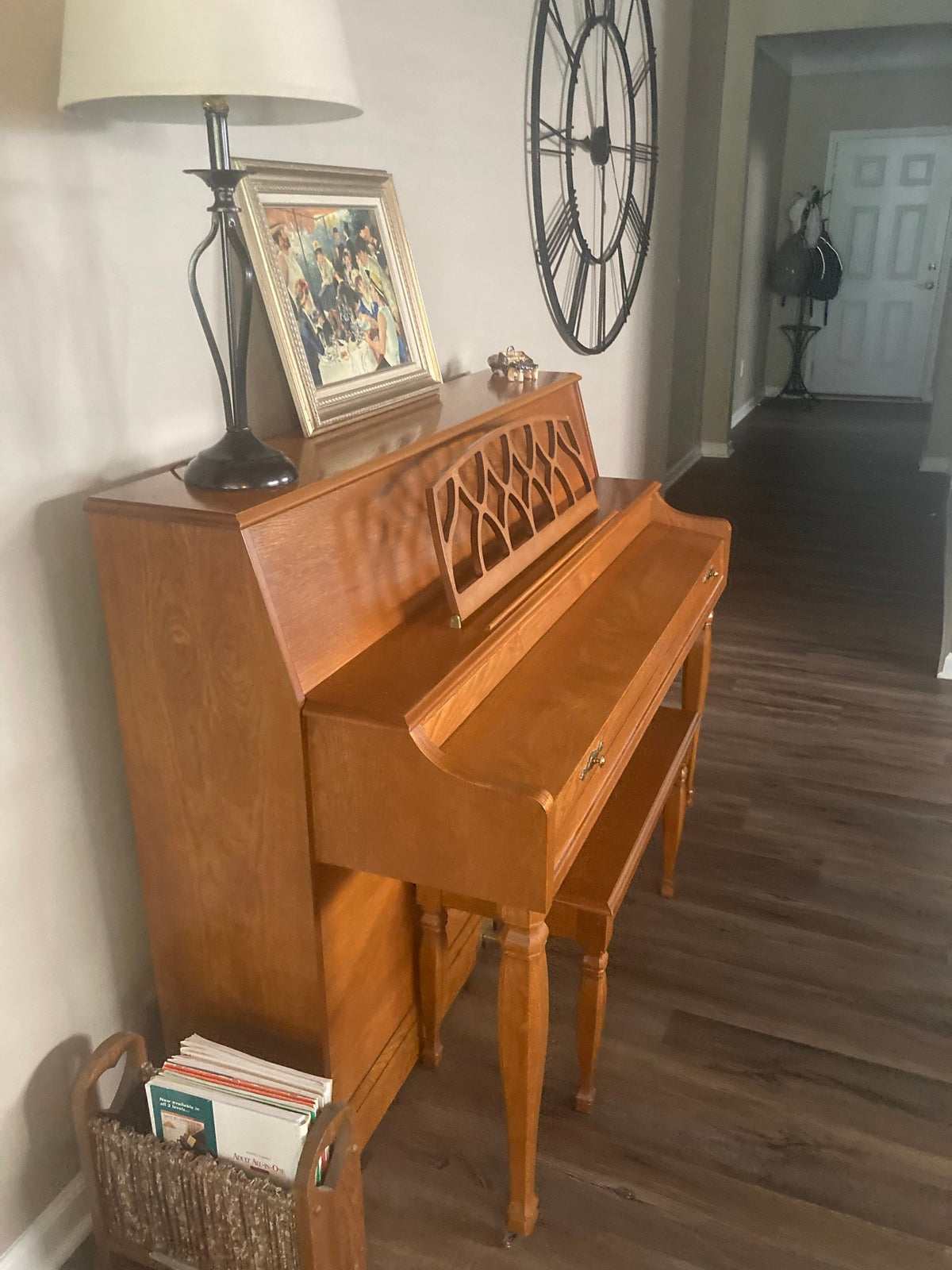 Baldwin 665 oak console piano with matching bench seen from the keyboard side