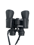 Black Celestron binoculars viewed from front, showing both eyepieces and central focus wheel with neck strap attached