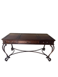 Full front view of wooden desk with three drawers, ornate curved legs, and tooled leather top surface
