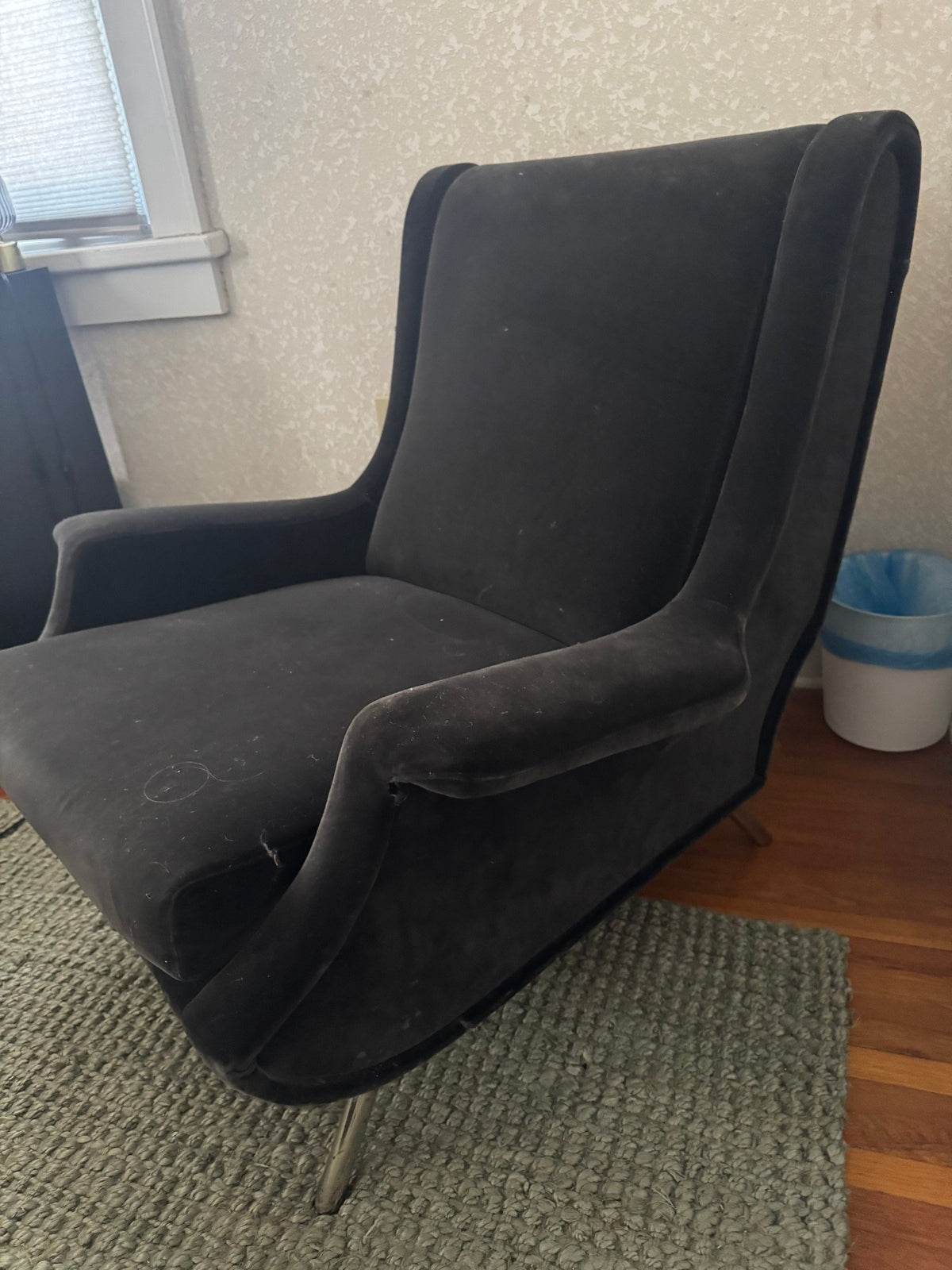 Side view of the chair showing the wing and legs