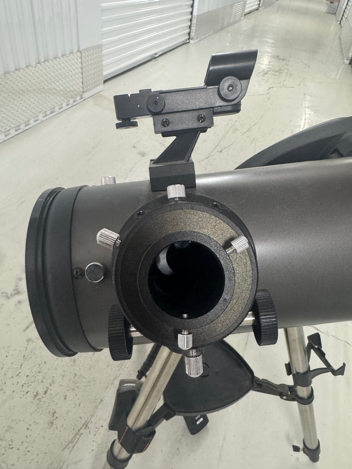 Rear view of telescope tube showing eyepiece focuser with adjustment knobs and diagonal mirror