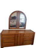 Oak dresser with arched cane-panel mirror above it
