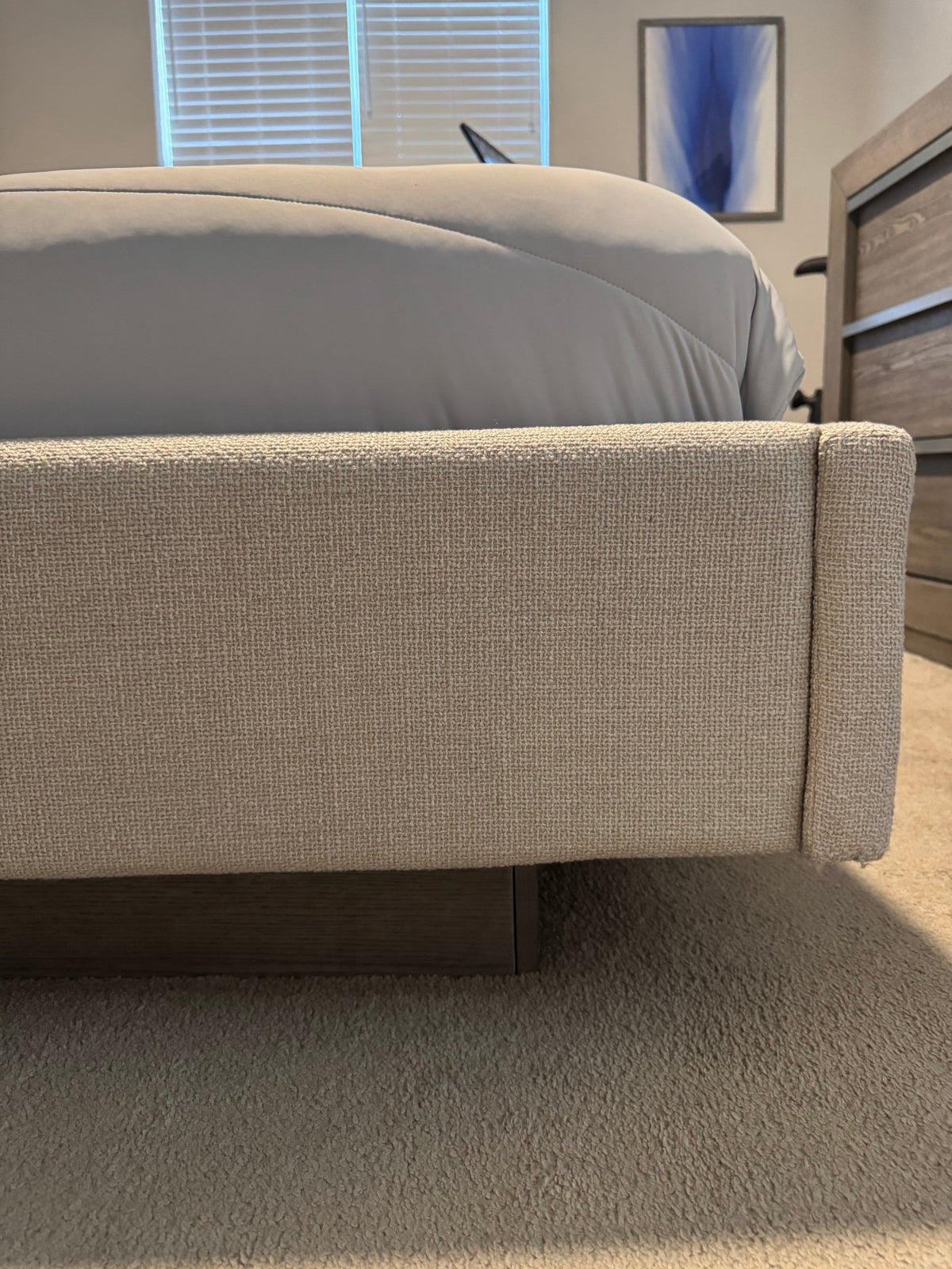 Upholstered footboard of the queen bed