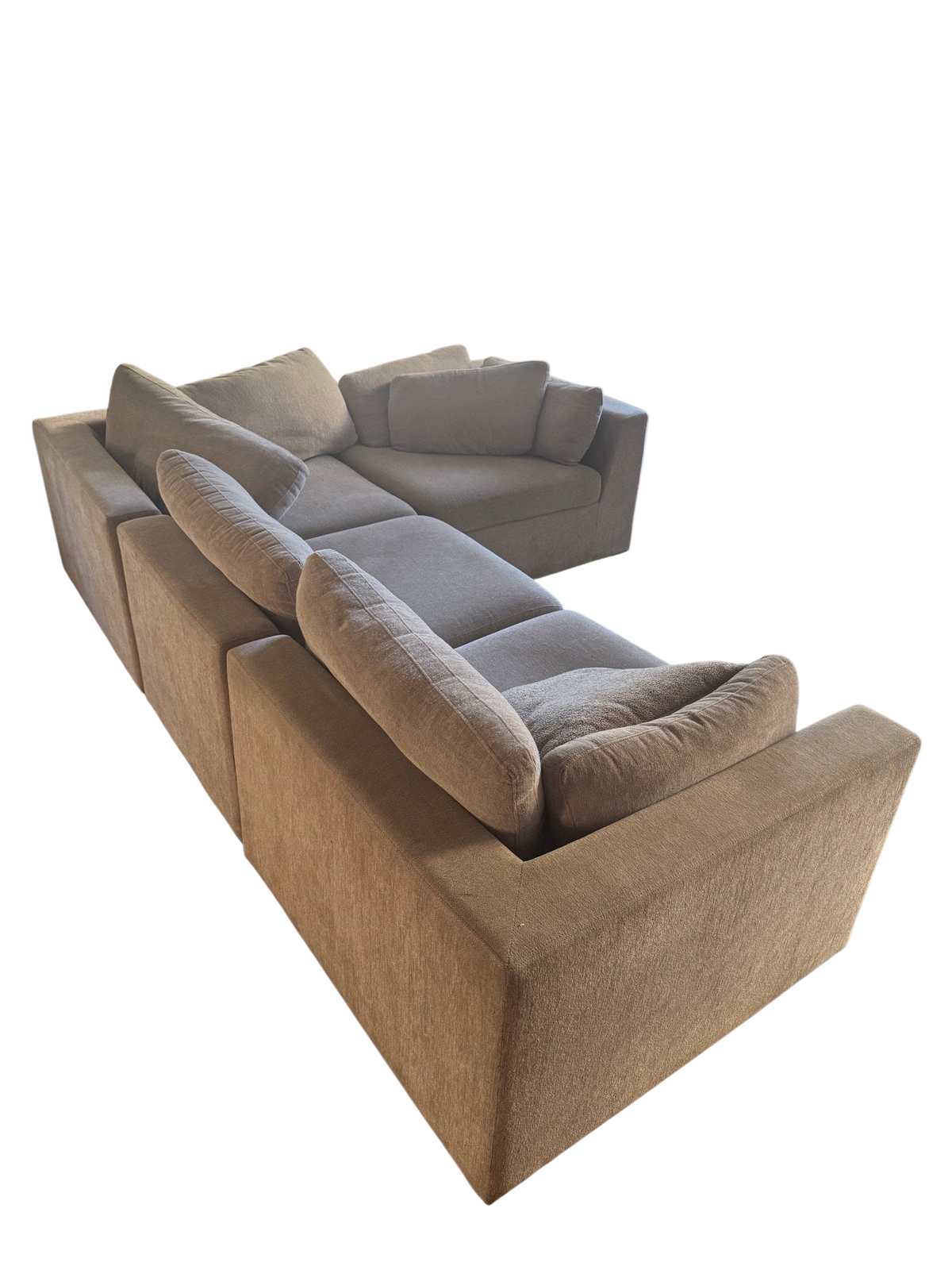 Grey modular sectional sofa seen from the side in a living room