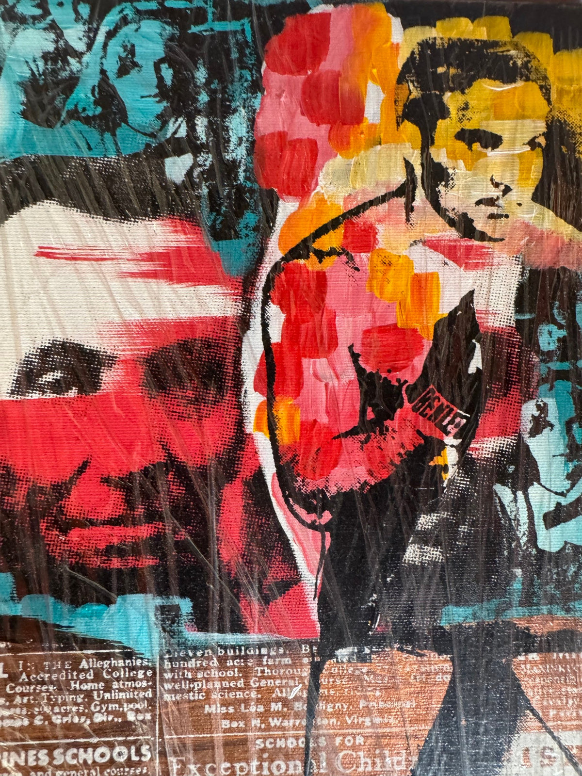 Close view of the newsprint and painted faces