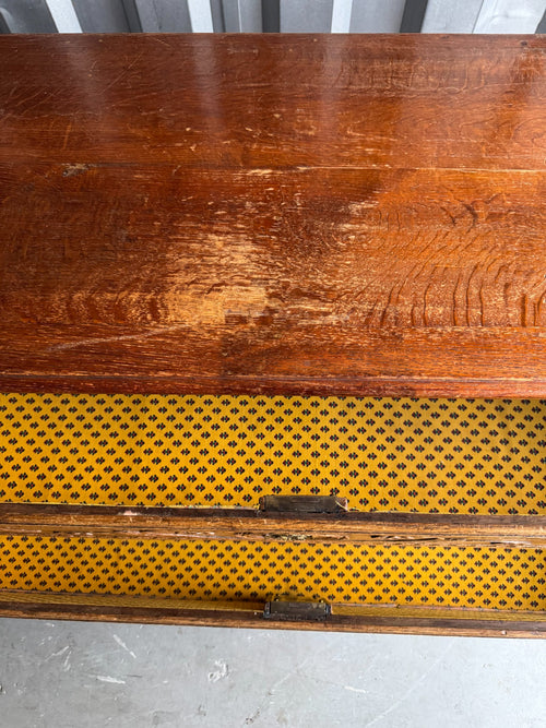 Close-up of top surface showing wood grain, patina, and wear marks