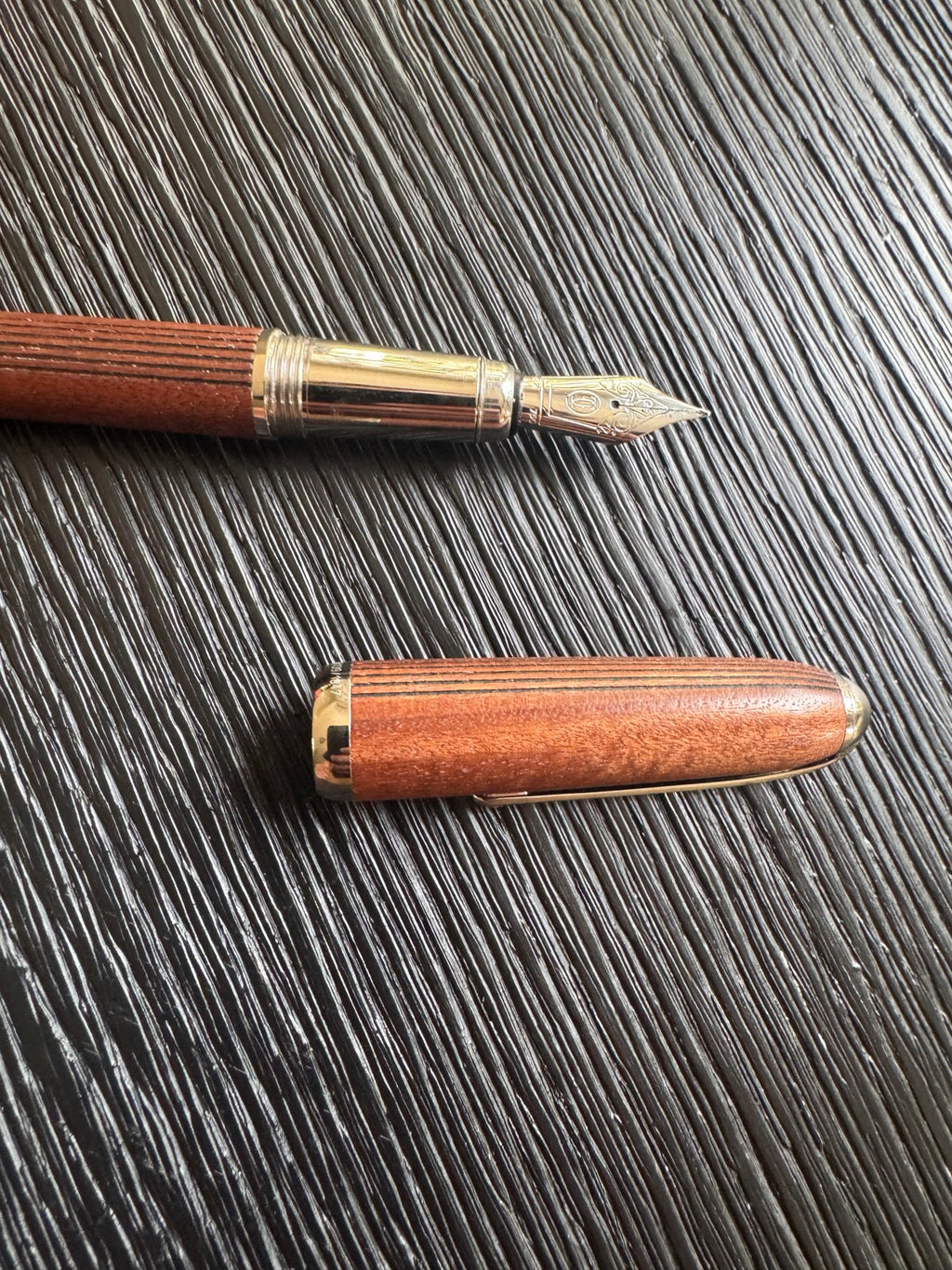 Complete wooden fountain pen with natural wood barrel, polished finish, and gold-colored metal components