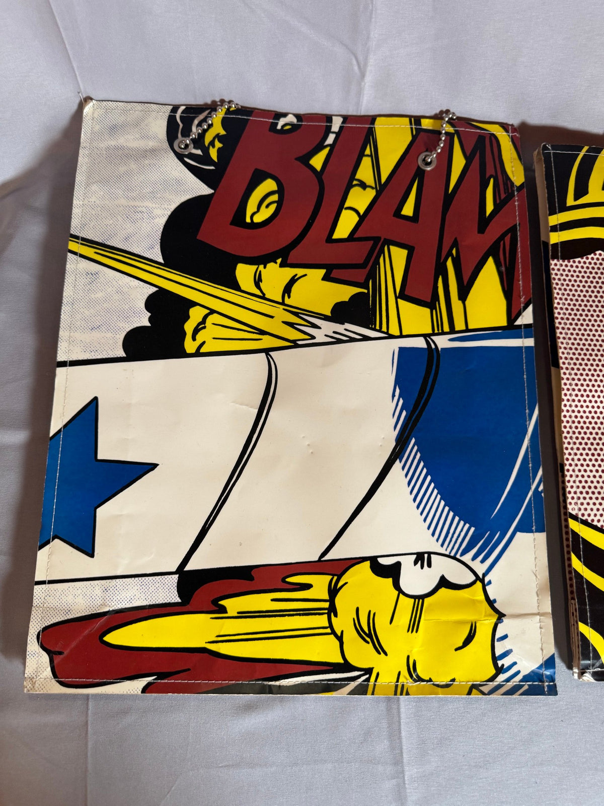 Close view of comic-panel artwork on a bag