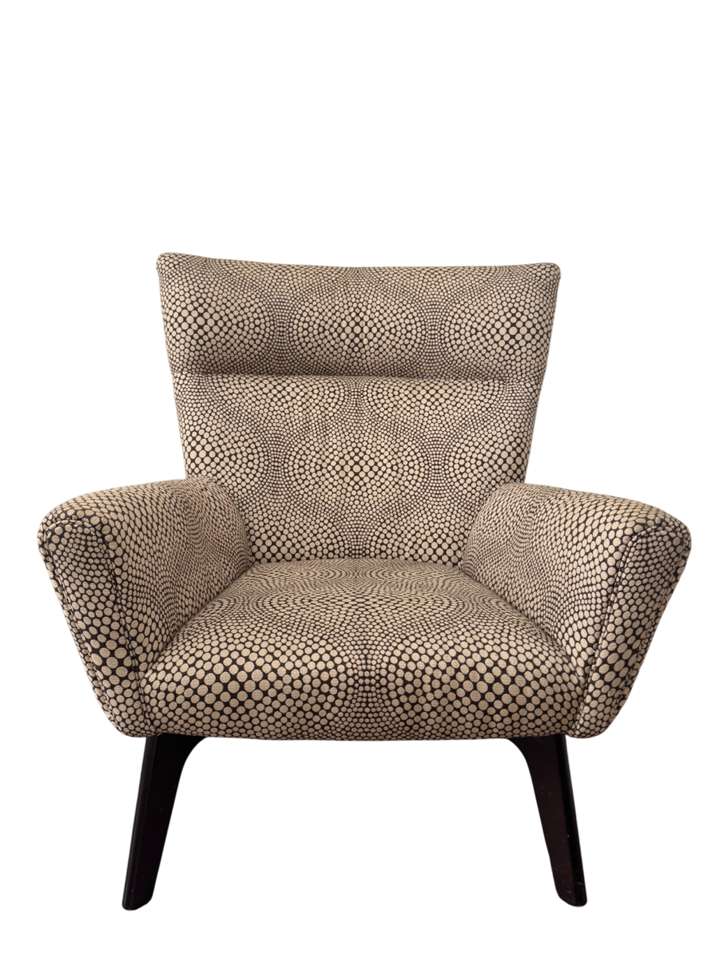 Front view of cream and black dot patterned lounge chair with high back, rolled arms, and dark wooden splayed legs