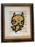 Framed black-ink cat creature on Drunken Sailor sheet music, straight-on