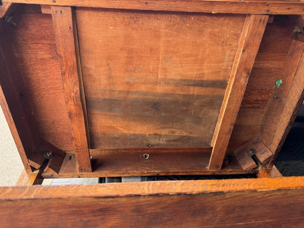 Interior view of chair base showing support structure and wood joinery