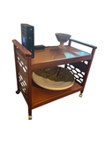 Wood tea trolley with pierced sides and casters