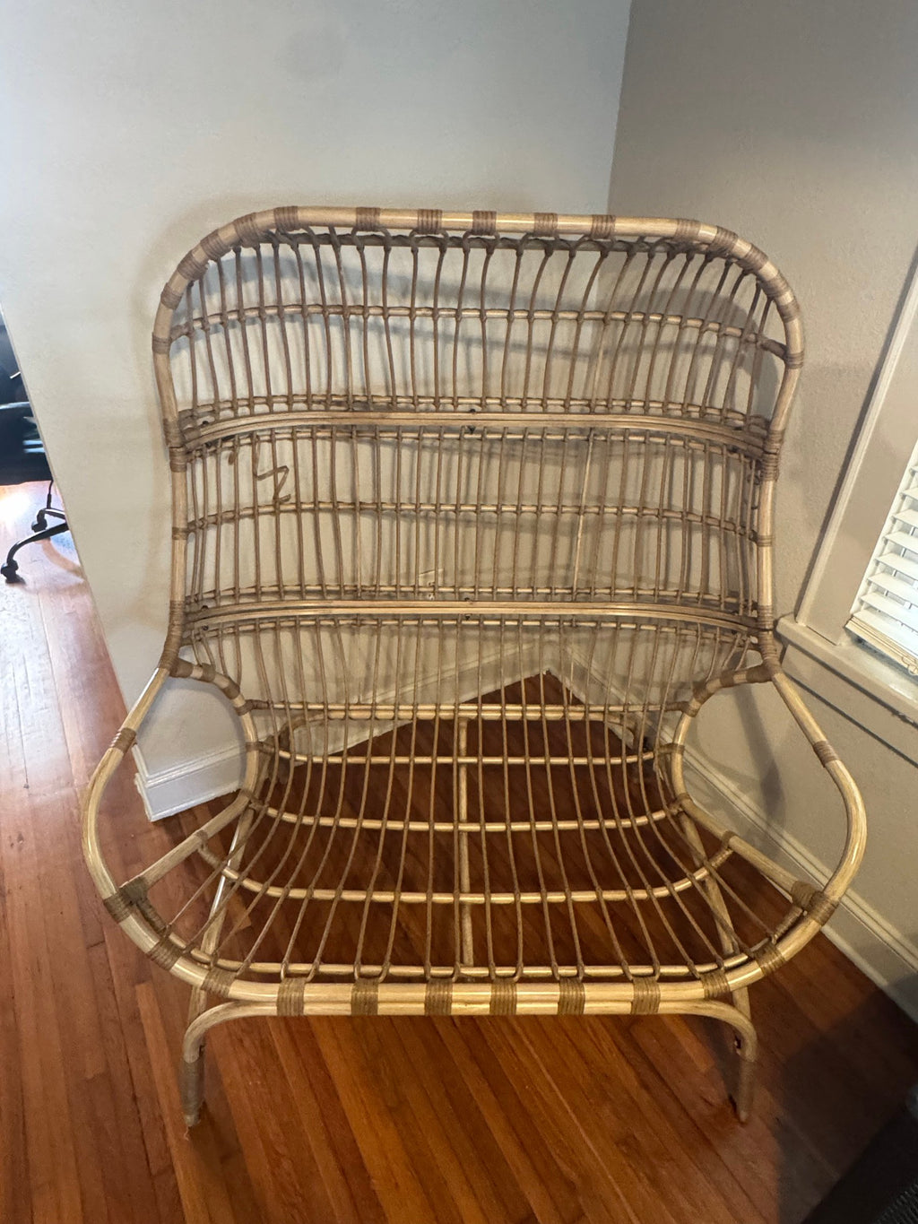 Rattan loveseat with the cushion removed